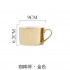 Golden coffee cup